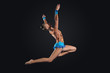 Young woman in gymnast suit posing