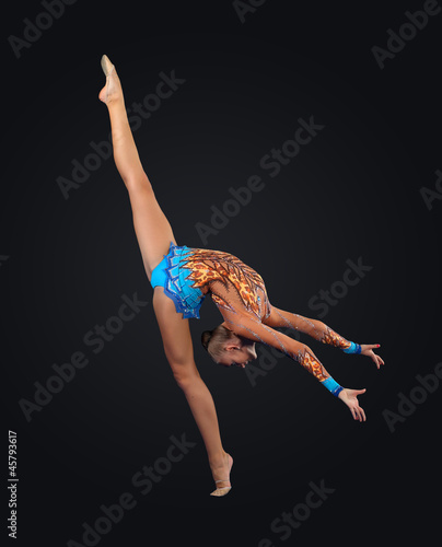 Photo: Young woman in gymnast suit posing Young woman in gymnast suit posing