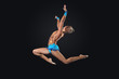 Young woman in gymnast suit posing