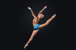 Young woman in gymnast suit posing