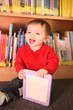Photo: Young Boy in Library Young Boy in Library