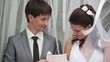 The bride and groom received a document of marriage