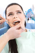 Dentist examines the oral cavity of the patient