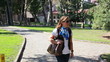 Video: woman walking on the park, steady cam shoot woman walking on the park, steady cam shoot