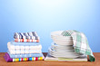 kitchen towels with dishes on blue background close-up