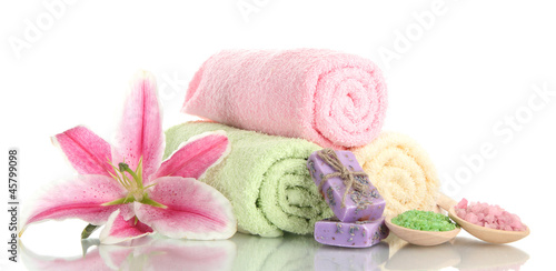 Photo: towels with beautiful pink lily, aroma oil and sea salt towels with beautiful pink lily, aroma oil and sea salt