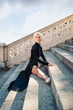 Young beautiful ballerina with black long dress posing on Pincio
