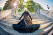 Young beautiful ballerina with black long dress posing on Pincio