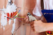 Electrician hands with pliers