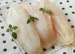 fish fillet with mint leaves isolated on homey background
