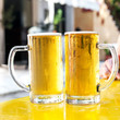 Two glasses full of fresh beer