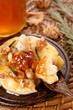 Cheese baked with honey, nuts and herbs