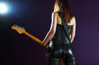 Sexy female playing an electric guitar