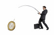 Ejecutivo atrapando,pescando un euro,concepto de negocios.