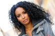Young black woman, afro hairstyle, in urban background