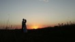 Silhouettes of lovers at sunset.