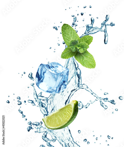 Photo: Ice cubes, mint leaves and lime on a white Ice cubes, mint leaves and lime on a white