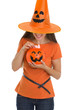 Woman holding Halloween bucket with sweets