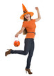 Full length portrait of happy woman holding Halloween bucket