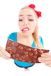 Funny unhappy girl with a chocolate isolated on white