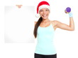 Photo: Christmas fitness woman showing sign Christmas fitness woman showing sign