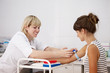 Nurse taking blood sample