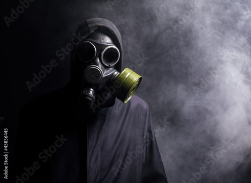 Photo: A man in a gas mask in the smoke A man in a gas mask in the smoke