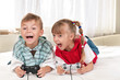 Happy girl and boy playing a video game