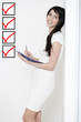 Photo: Woman with white dress holding documents Woman with white dress holding documents