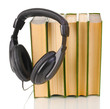 Headphones on books isolated on white
