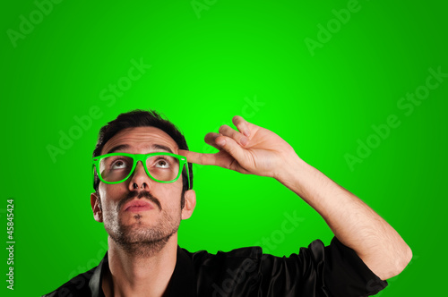 Photo: thoughtful man with green eyeglasses thoughtful man with green eyeglasses