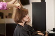 A female client having a blow dry in a hairdressing salon