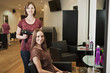 A female hairdresser and female client in a hairdressing salon