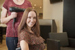 A female client showing off her new haircut