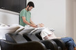 A male hairdresser shampooing a female clients hair