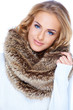 Gorgeous blond woman wearing fur scarf and smiling