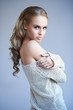 Pretty blonde girl posing while isolated
