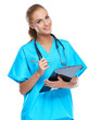 Photo: Cute nurse looking at the camera and smiling with writingpad Cute nurse looking at the camera and smiling with writingpad