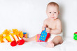 The sitting kid with toys