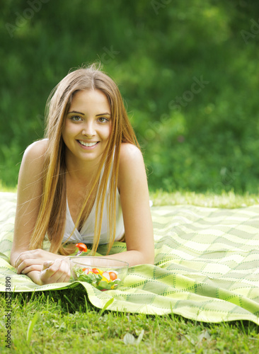 Photo: Healthy woman eating salad Healthy woman eating salad