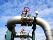 Industrial zone, Steel pipelines and valves against blue sky
