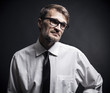 portrait of a man with a beard wearing glasses