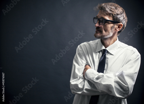 Photo: portrait of a man with a beard wearing glasses portrait of a man with a beard wearing glasses