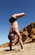 Photo: Man doing vertical handstand with lotus Man doing vertical handstand with lotus