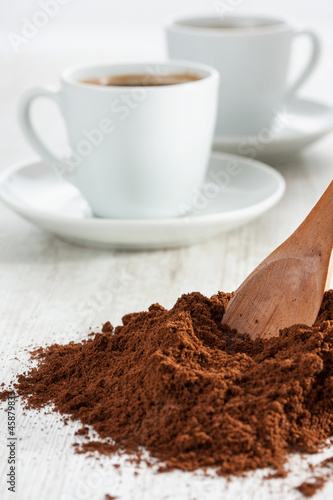 Photo: Freshly ground coffee and a cup Freshly ground coffee and a cup