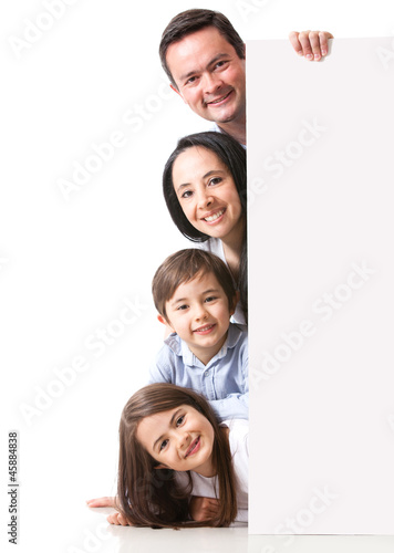 Photo: Happy family with a banner Happy family with a banner