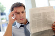 Businessman Reading Newspaper ...