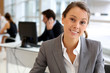 Portrait of attractive businesswoman sitting in office