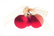 Three Christmas red baubles tied with golden ribbon