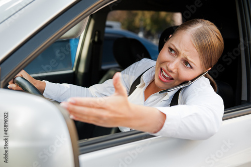 Photo: angry female driving the car angry female driving the car